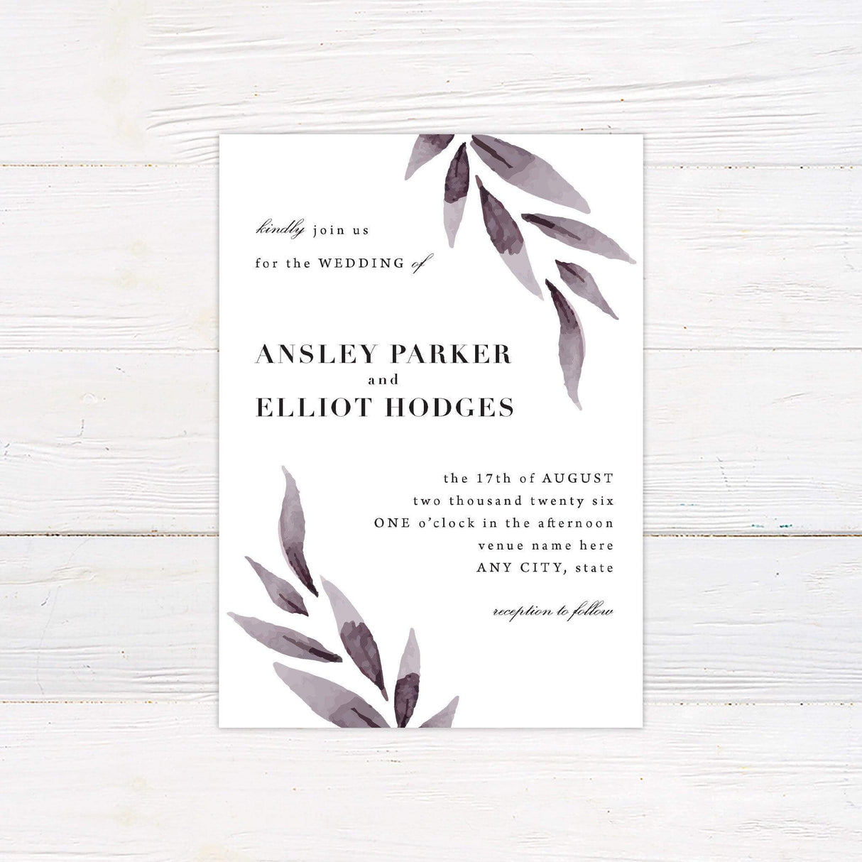 Minimalist wedding invitation with cascading watercolor purple leaves, modern serif typography, and calligraphy accents, printed on white cardstock