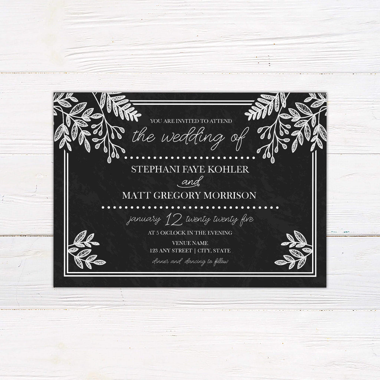 Rustic chalkboard wedding invitation with white botanical leaf illustrations and elegant handwritten script and serif fonts.