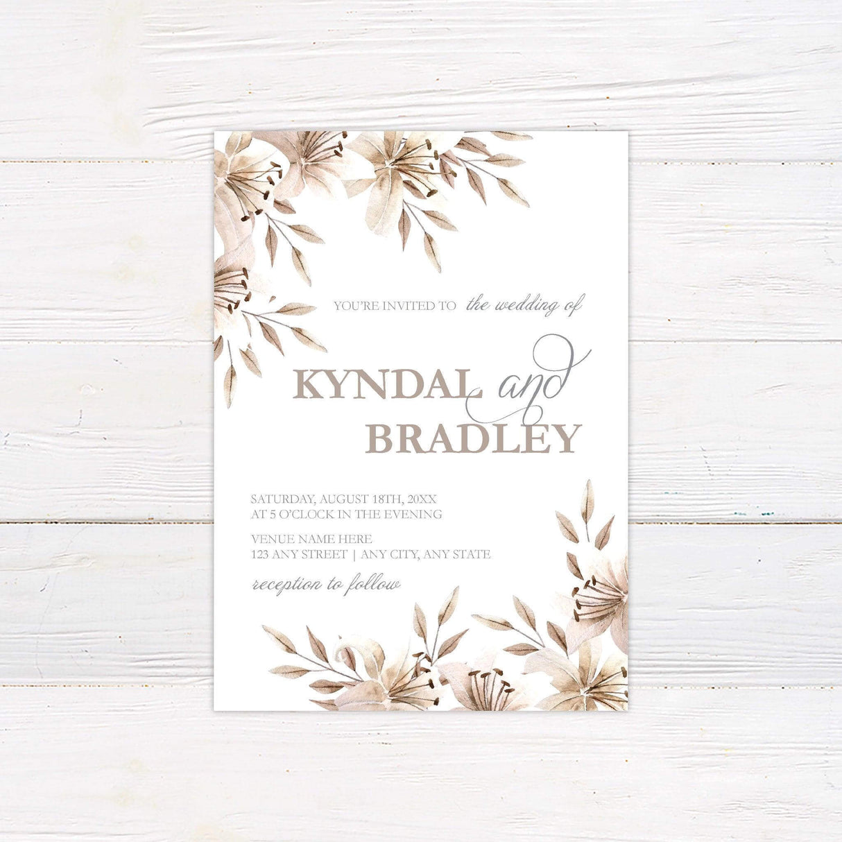 Elegant wedding invitation with pink watercolor flowers and greenery on a white background.