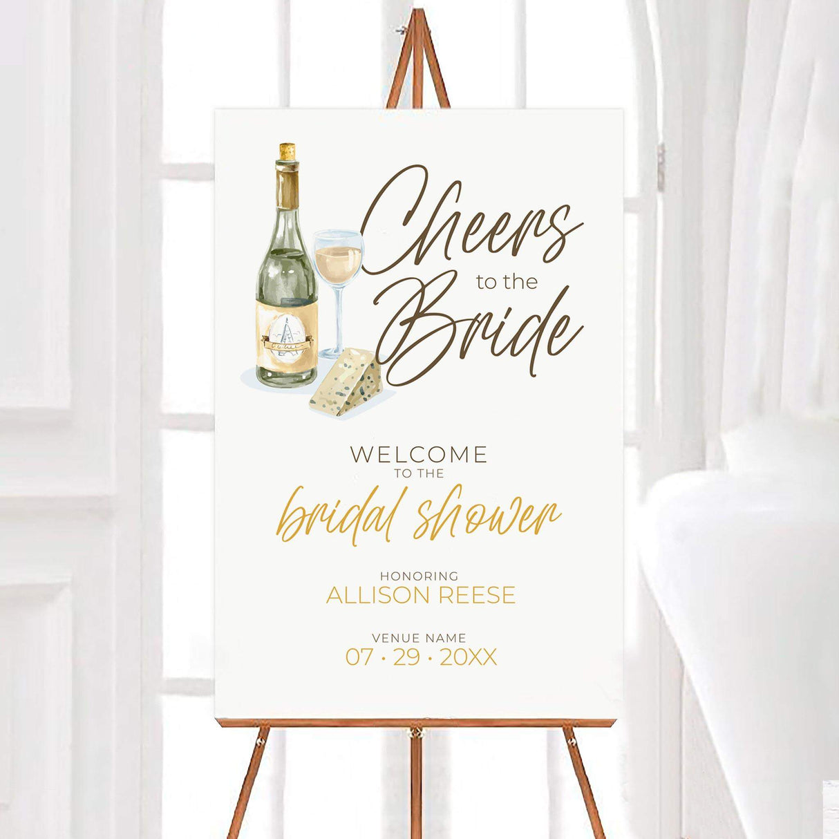 Elegant 'Cheers to the Bride' invitation on an easel, featuring champagne, cheese, and text for a bridal shower event.