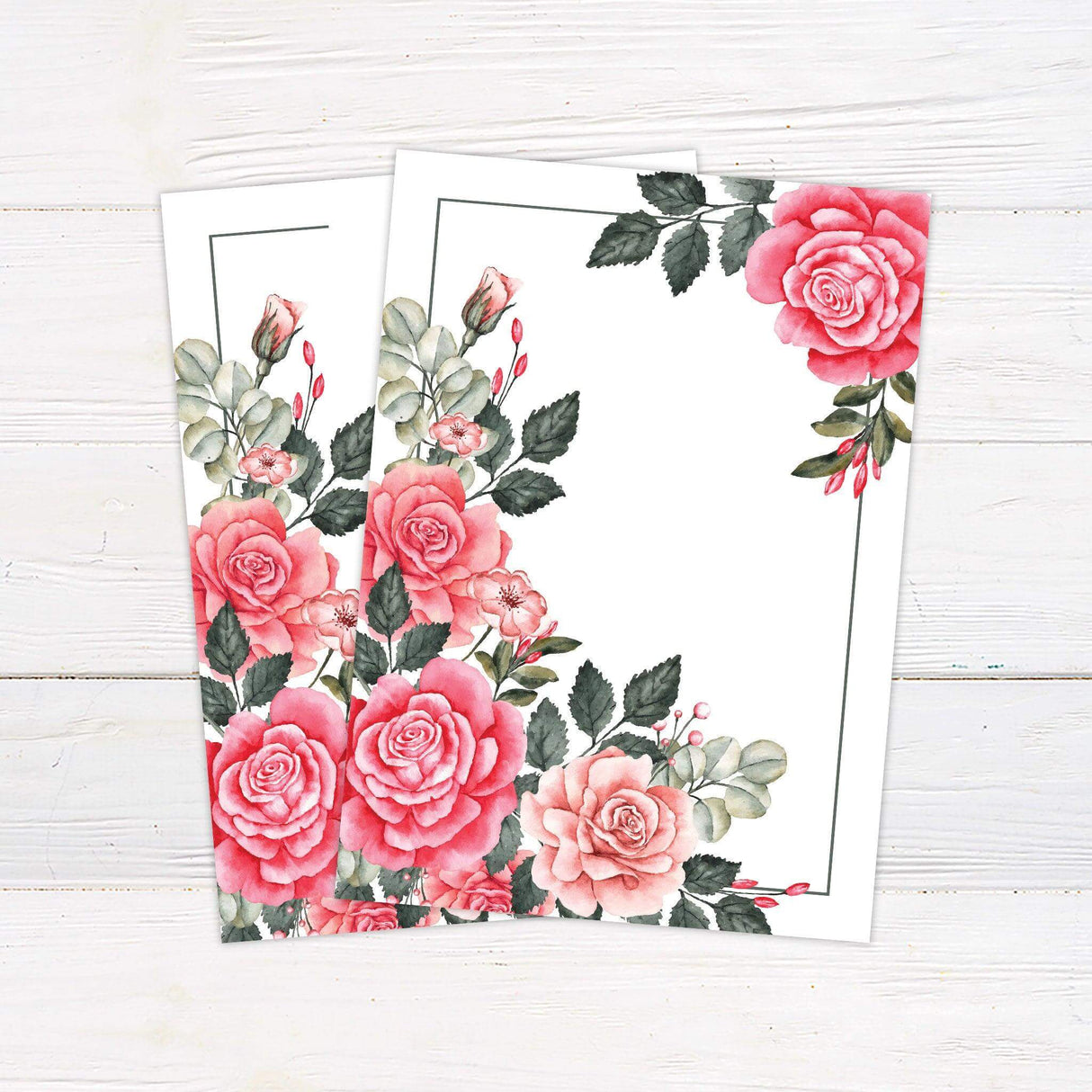 Wedding invitation with bold pink and blush watercolor roses, green foliage, and elegant serif fonts on a white background. - back