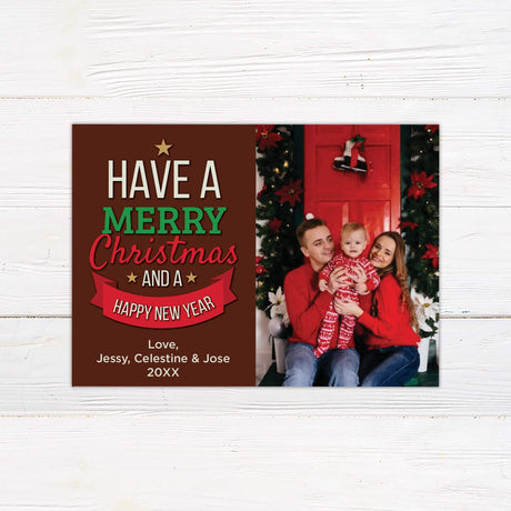 Merry Christmas and Happy New Year card with bold holiday text, personalized family photo, and festive red and green design.