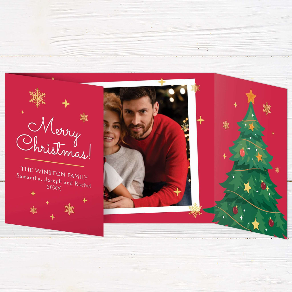 Gatefold Christmas card with a festive red background, decorated with gold snowflakes, a large illustrated Christmas tree, and photo frames with family holiday moments. The design includes a cheerful “Merry Christmas” message and space for personalized names and year details.