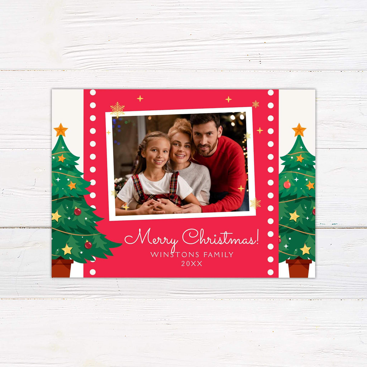 Christmas card with a customizable family photo framed by a bright red border, decorated Christmas trees, and a festive holiday greeting.