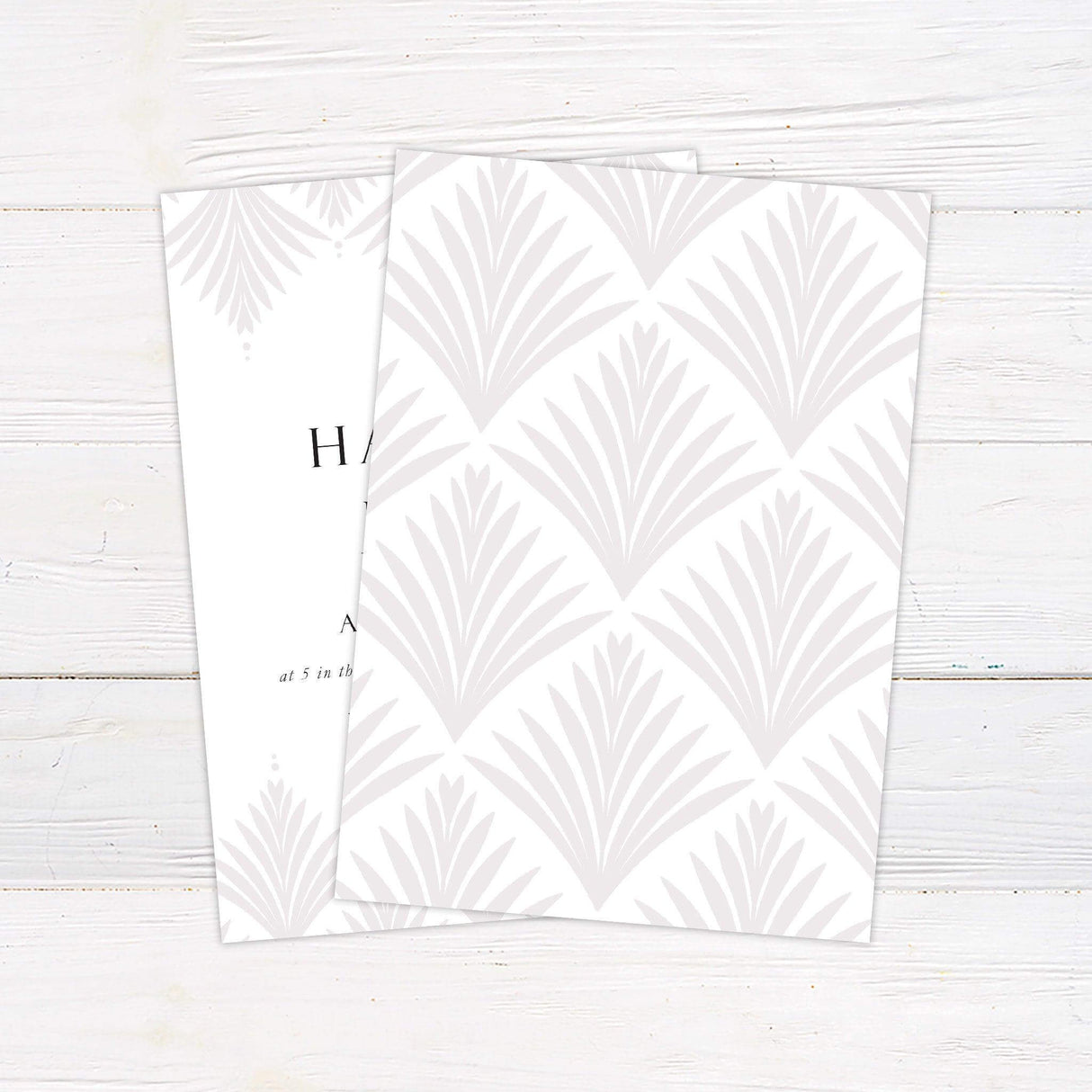 Classic wedding invitation with Art Deco pattern, serif and script fonts, and curved text layout on a white background. - back