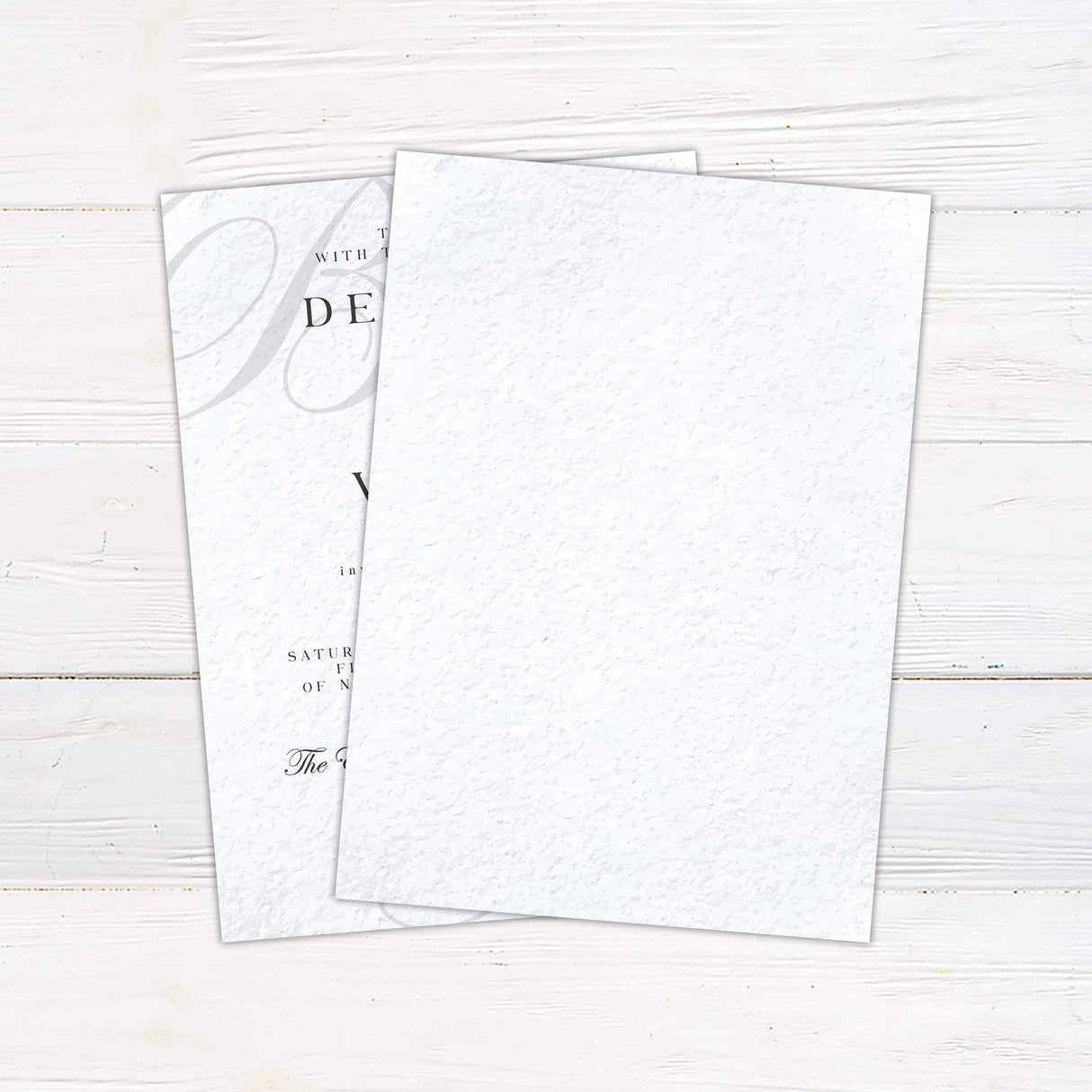 Elegant wedding invitation featuring monogram initials, classic serif fonts, and formal layout on a neutral textured background - back