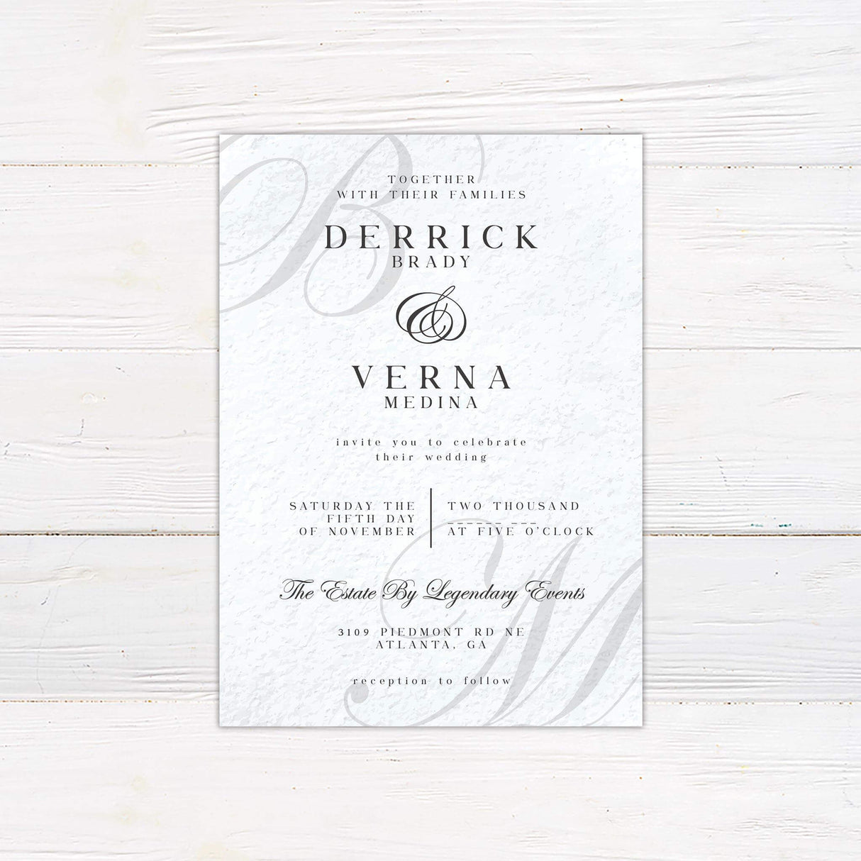Elegant wedding invitation featuring monogram initials, classic serif fonts, and formal layout on a neutral textured background