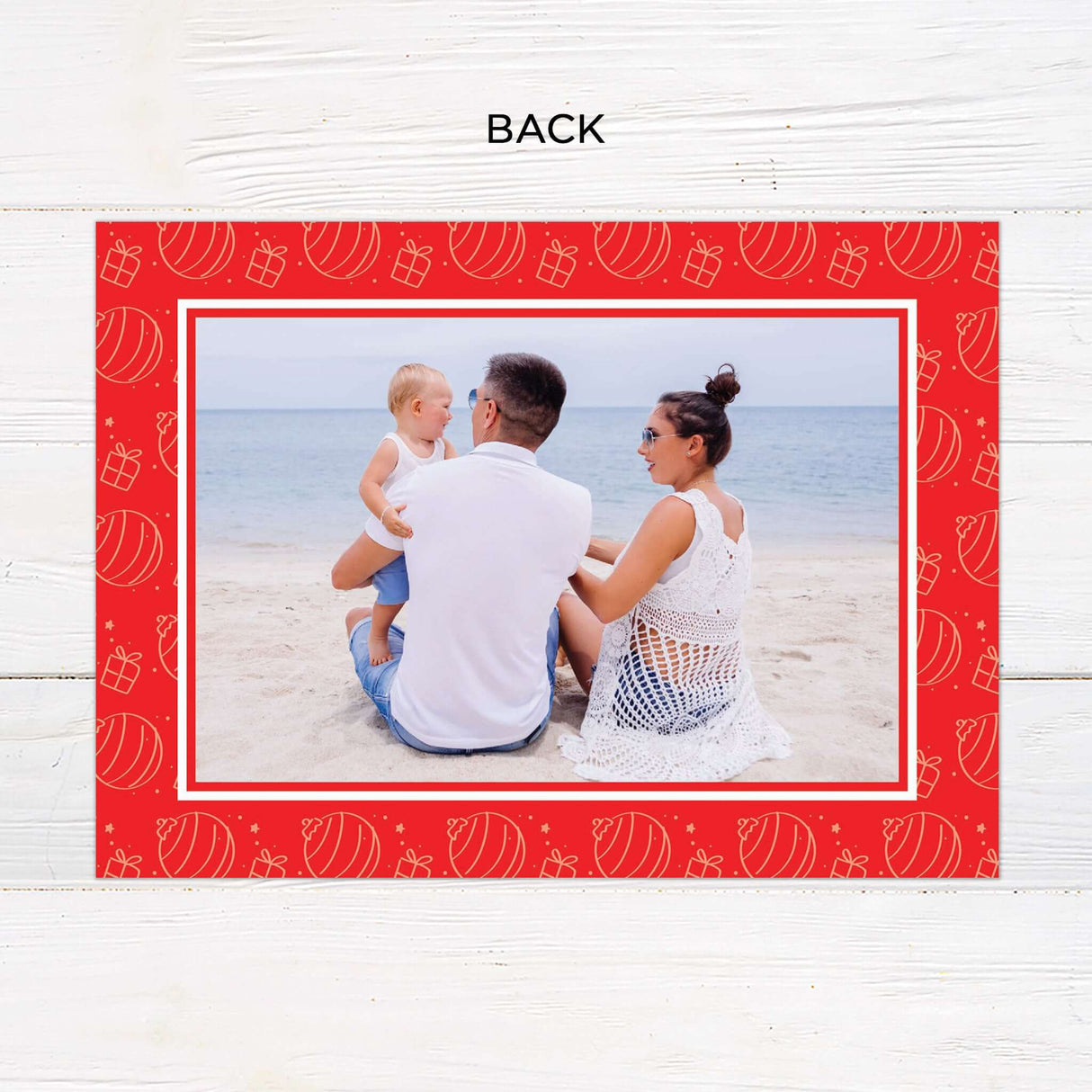 This festive holiday card design features a bold red background with modern typography and personalized photo placement. The layout is perfect for showcasing warm beachside or outdoor family moments and includes space for heartfelt greetings and names. - back.