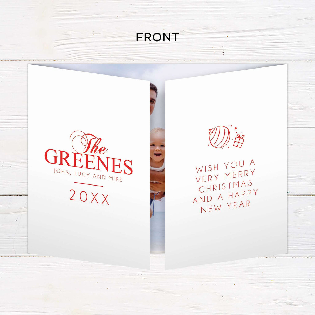 This festive holiday card design features a bold red background with modern typography and personalized photo placement. The layout is perfect for showcasing warm beachside or outdoor family moments and includes space for heartfelt greetings and names. - front.