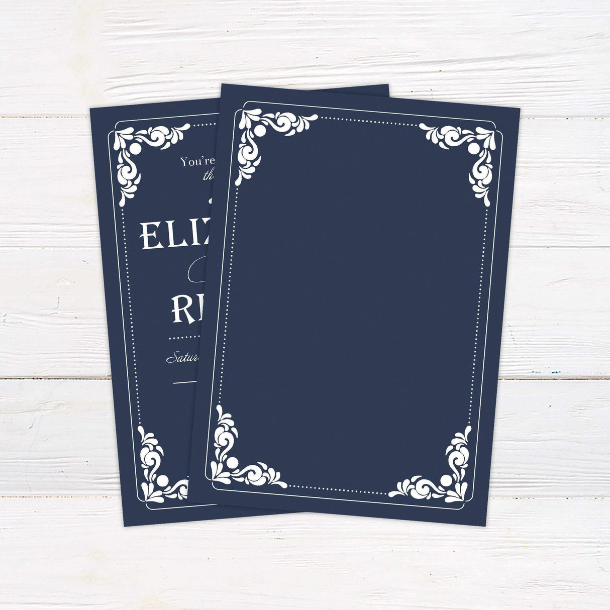 Vintage navy wedding invitation with white serif and script fonts, ornate scrollwork flourishes, and formal layout. back