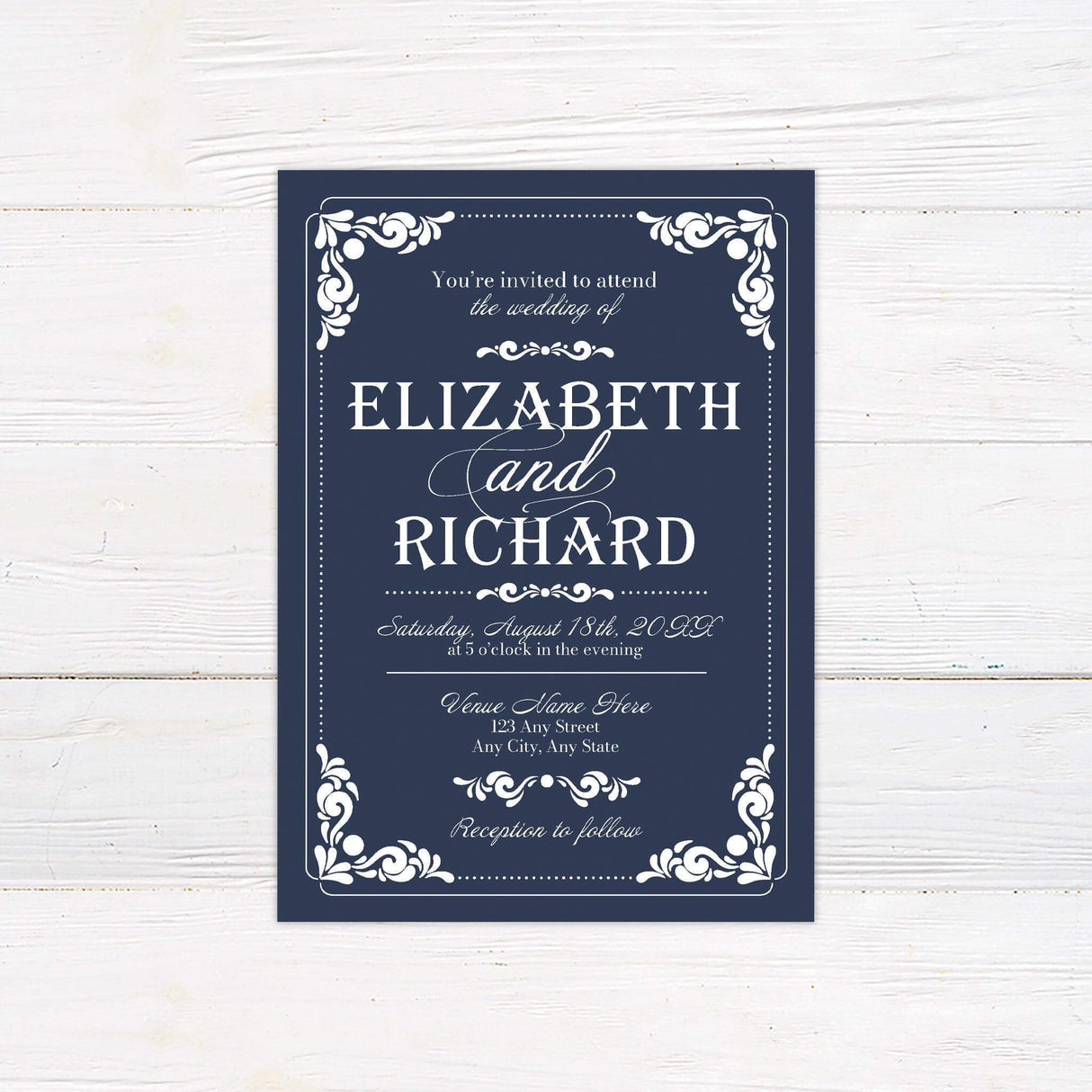 Vintage navy wedding invitation with white serif and script fonts, ornate scrollwork flourishes, and formal layout.