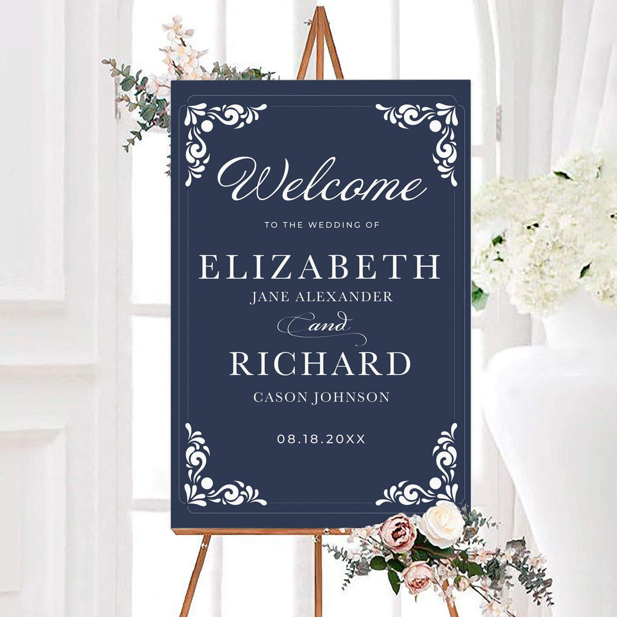 Personalized vintage navy wedding welcome sign featuring an ornate white scrollwork border, elegant script lettering, and classic serif typography on a slate blue background. The formal wedding sign includes customizable couple's names and wedding date within a decorative frame.