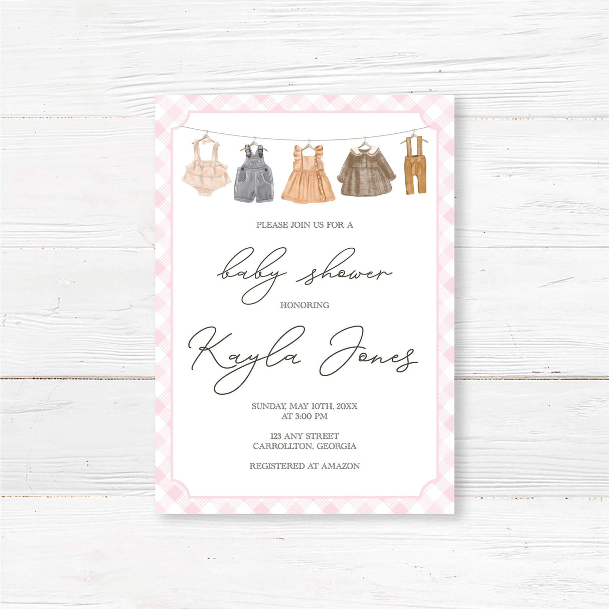 Rustic baby shower invitation with vintage clothesline illustration and pink gingham border, perfect for country-themed gatherings.