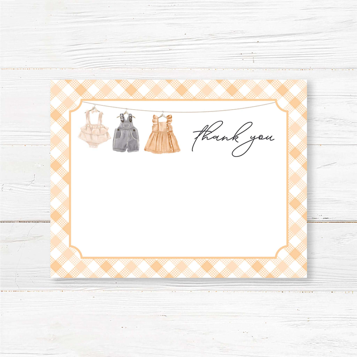 Printed baby shower thank you card featuring a charming baby clothesline and gingham border. Elegant and rustic design, perfect for sending heartfelt messages