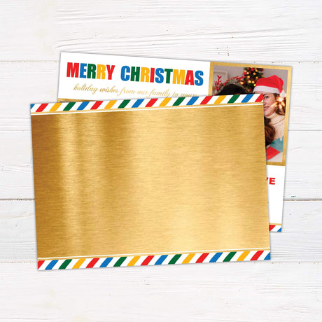 Colorful photo Christmas card with festive gold borders, rainbow "Merry Christmas" lettering, and customizable text featuring two women hugging and celebrating. back side