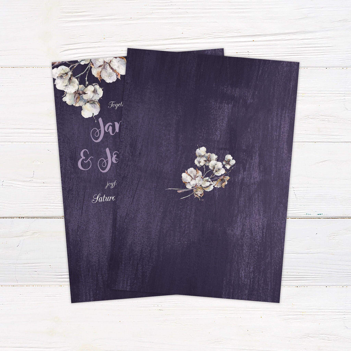 Rustic wedding invitation with purple woodgrain background, watercolor cotton flowers, and whimsical script and serif fonts - back