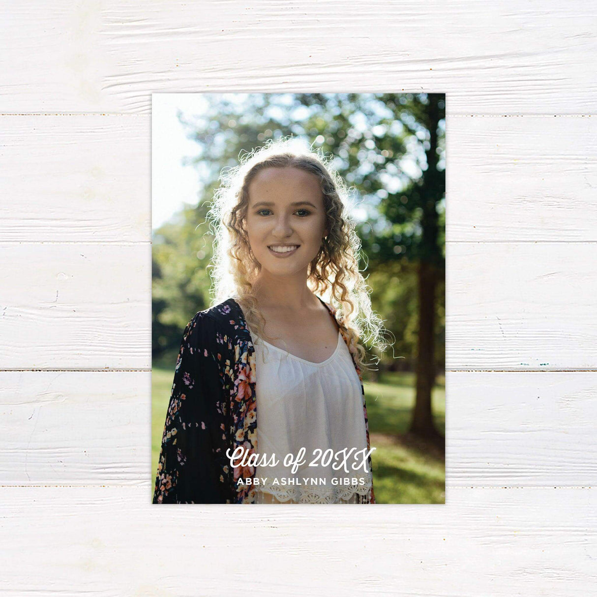 Modern graduation invitation featuring a customizable school color background with three graduate photos. The back includes a full-size portrait for a personal touch. Back.