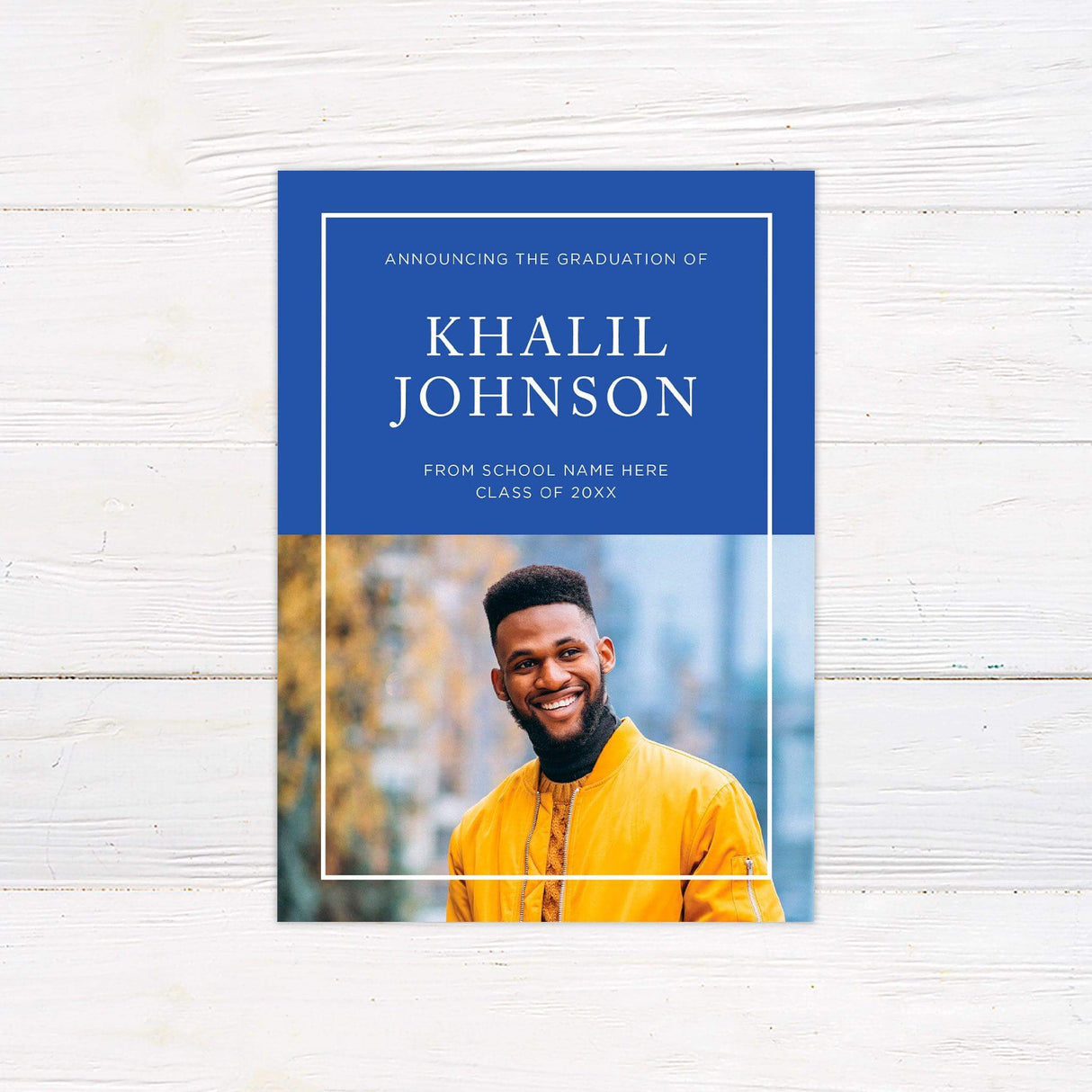 Graduation announcement with a modern split design featuring a bold color block on top with the graduate’s name and school details, and a large photo section below. The color scheme is customizable to match school colors. Blue.