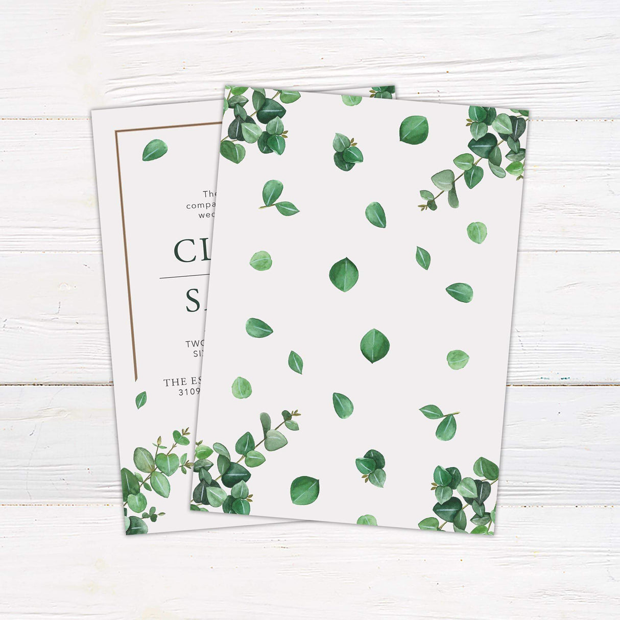 Minimalist eucalyptus wedding invitation with watercolor green leaves, serif and script fonts, and a clean layout on a white background = back