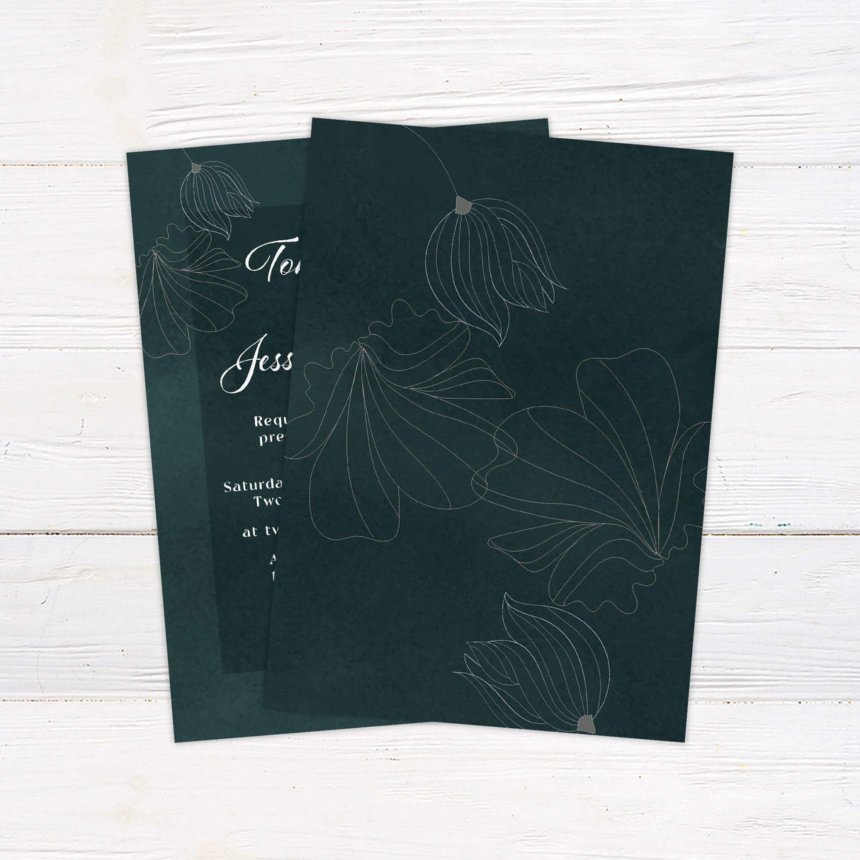 Dark green wedding invitation with white floral line art, elegant script names, serif body text, and a rich botanical background - back