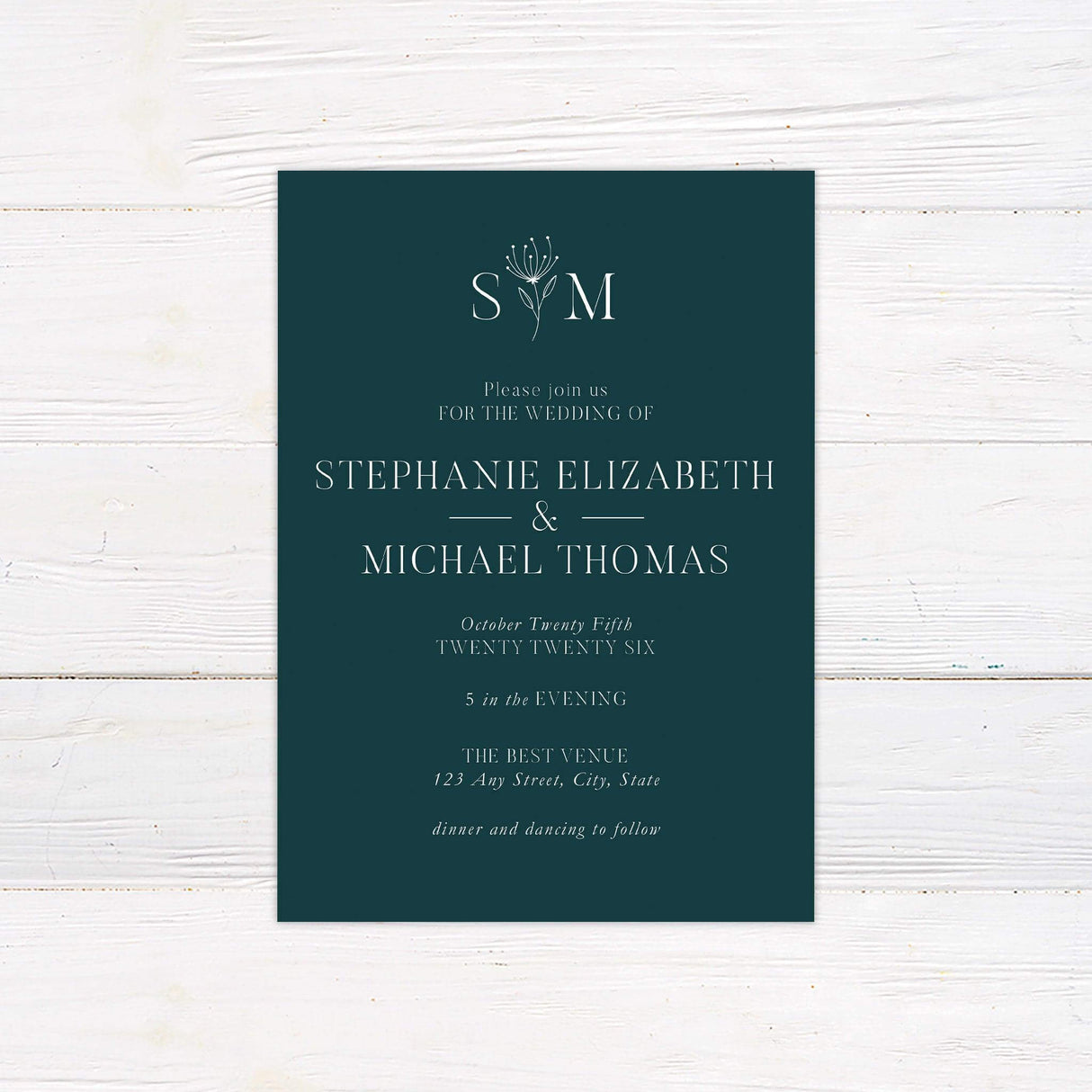 Elegant dark teal wedding invitation with white serif typography and floral monogram, ideal for formal and minimalist celebrations.