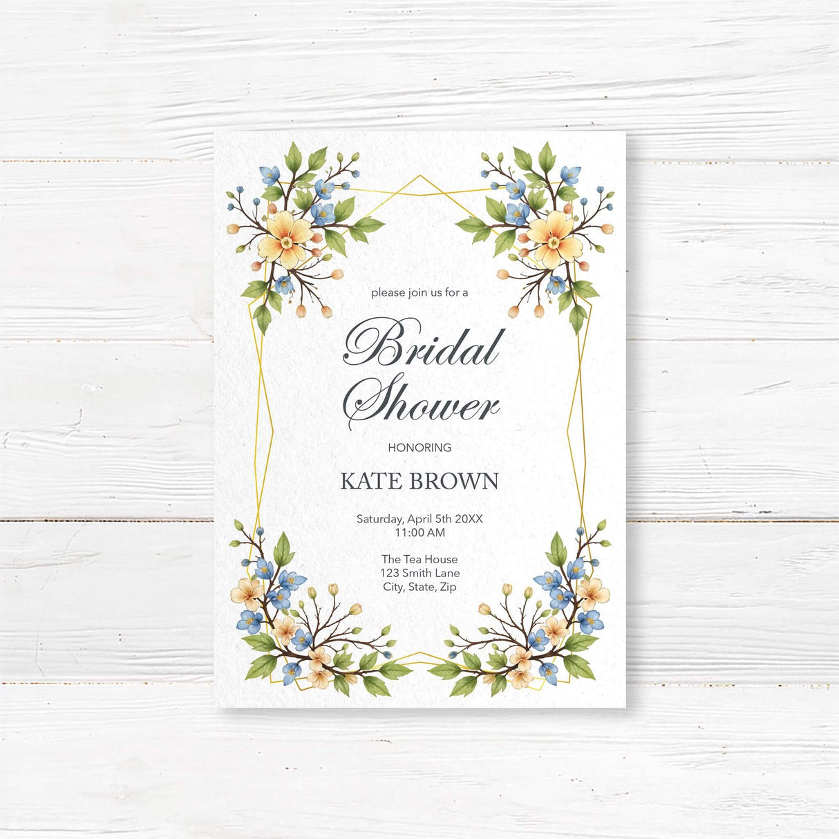 Elegant printed bridal shower invitation with pastel watercolor flowers in yellow and blue, arranged in a decorative geometric border. Features script and serif fonts with customizable shower details. Professionally printed on white background.