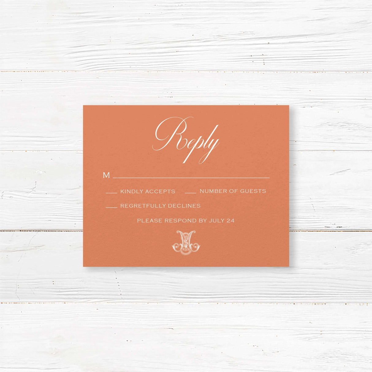 Terracotta RSVP card with white serif font for formal wedding response