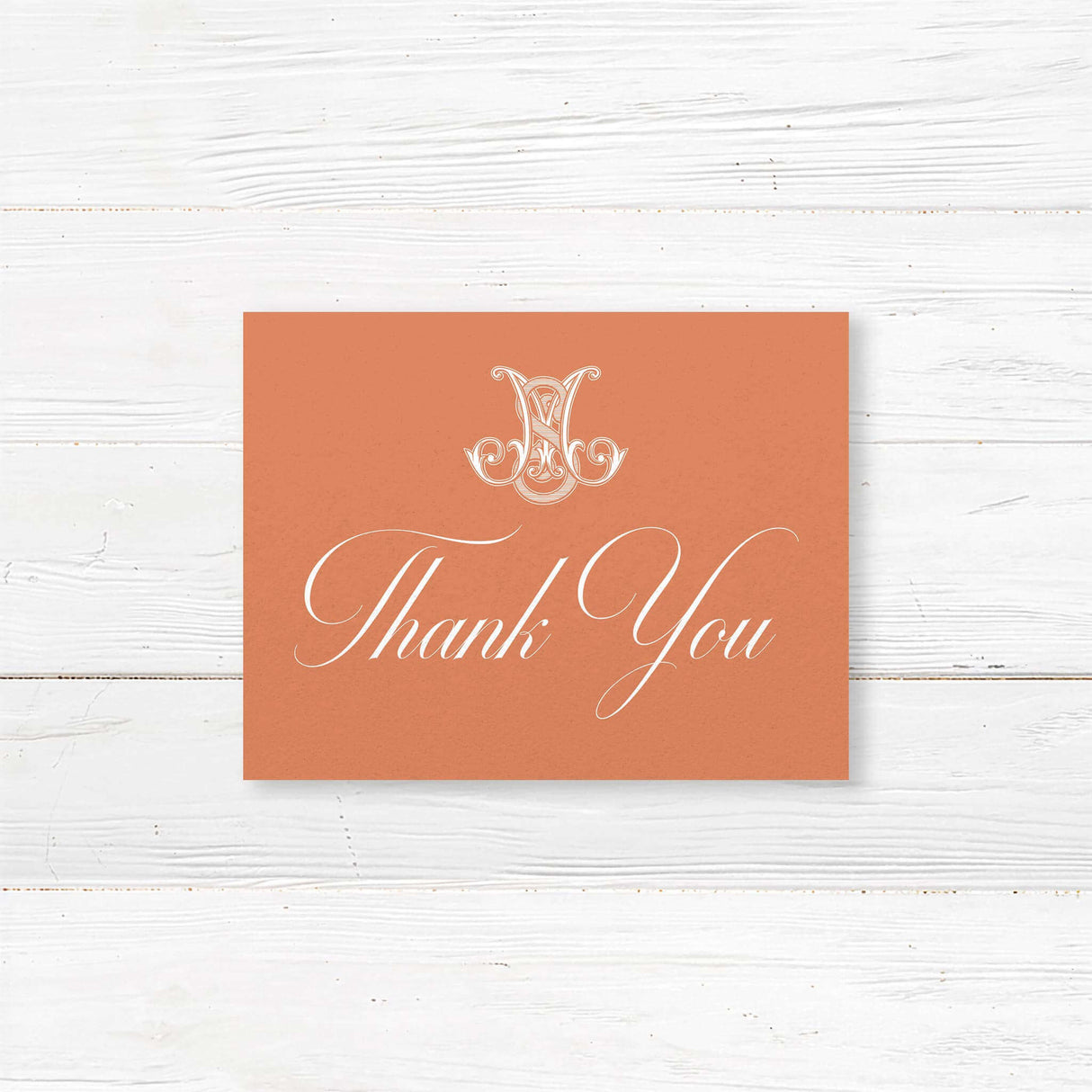 Terracotta thank you card with white fonts and Celtic-style monogram