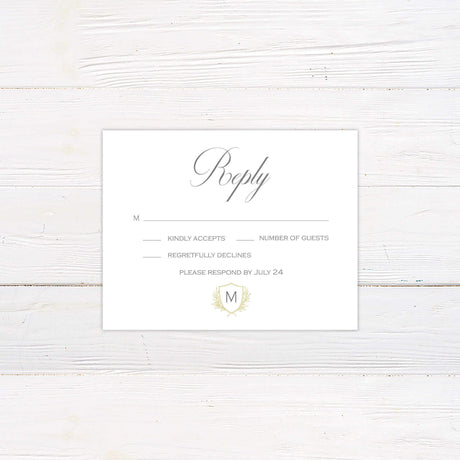 Elegant delicate shield invitation reply card with monogram crest and laurel design on ivory background for wedding RSVP