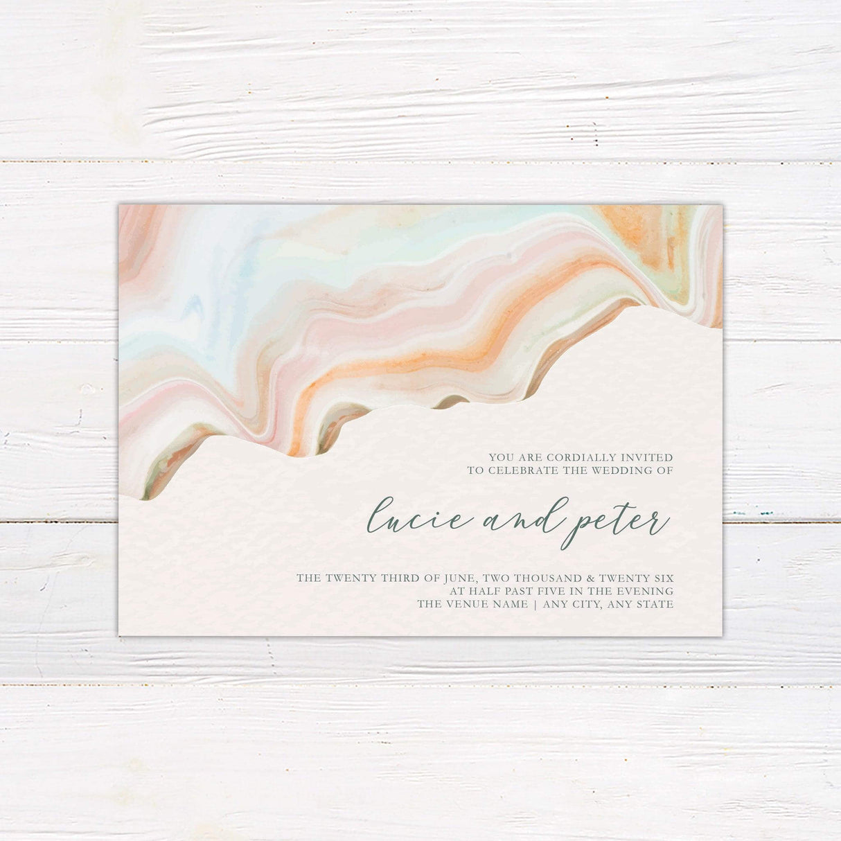 Modern pastel marbled wedding invitation with desert-inspired swirls of peach, green, and blush tones, featuring elegant serif and script fonts.