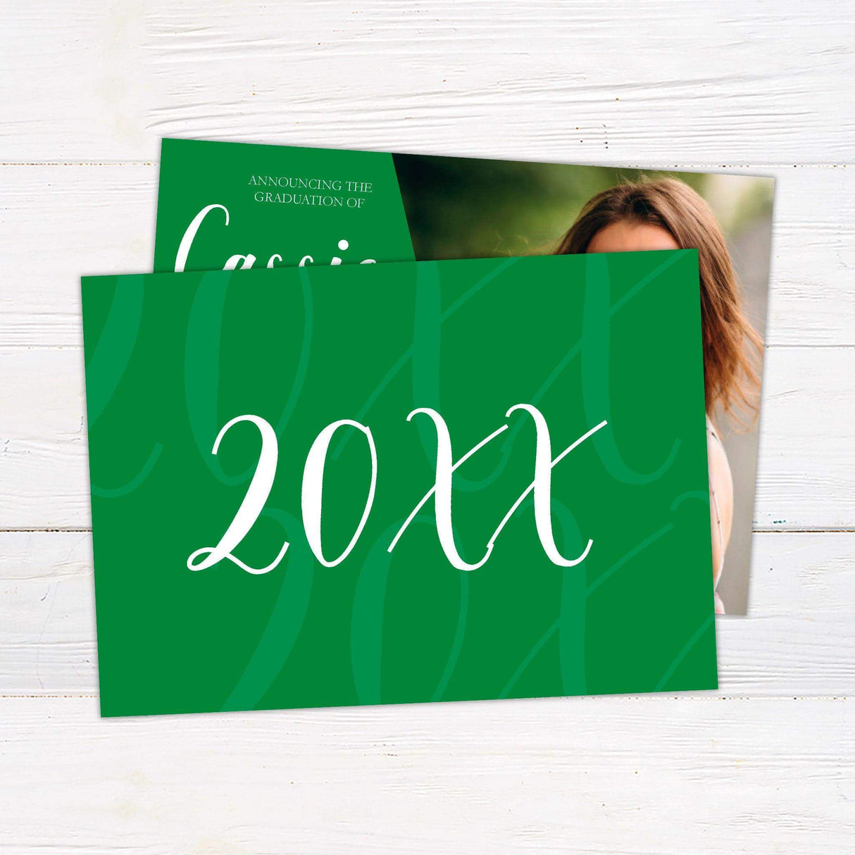 Graduation announcement featuring a bold diagonal design with a customizable color block on the left displaying the graduate's name and degree details in an elegant script. The right side showcases a full-size photo of the graduate. The back of the invitation includes additional photo options and class year details. Personalize the color to match the school colors. Back Green.