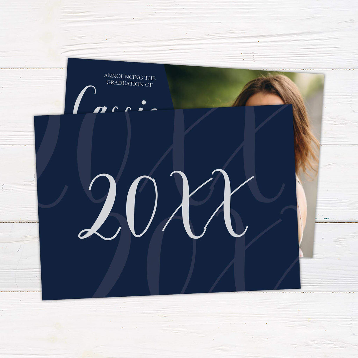 Graduation announcement featuring a bold diagonal design with a customizable color block on the left displaying the graduate's name and degree details in an elegant script. The right side showcases a full-size photo of the graduate. The back of the invitation includes additional photo options and class year details. Personalize the color to match the school colors. Back Navy.
