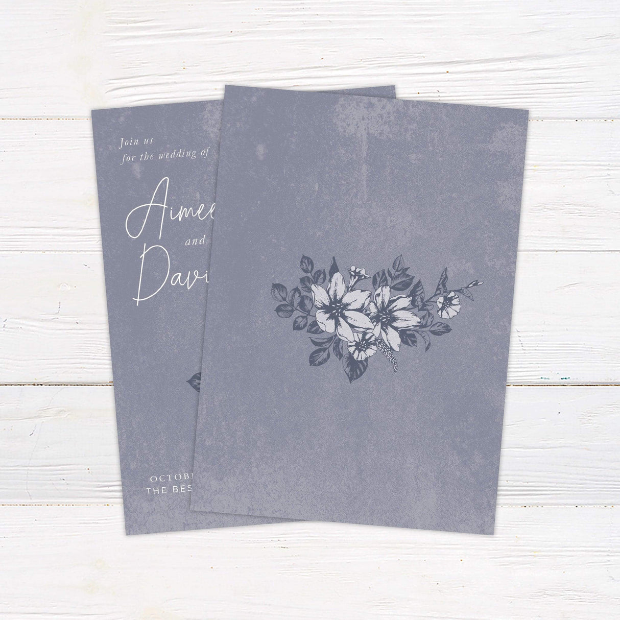 Elegant distressed blue wedding invitation with hand-drawn white florals, customizable with wedding details for a rustic or vintage celebration. - back