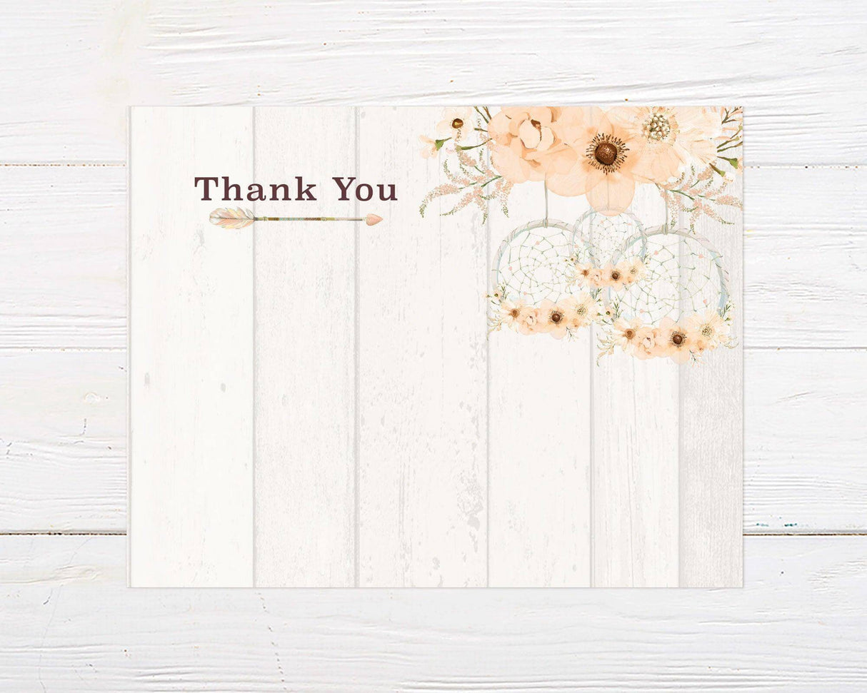 A bridal shower thank you card with peach flowers and a dream catcher design. The background has a light rustic wood texture with plenty of space to leave a message to all your guests.