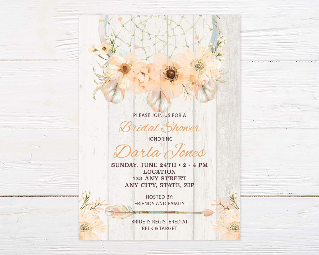 A bridal shower invitation with peach flowers and a dream catcher design. The background has a light rustic wood texture.