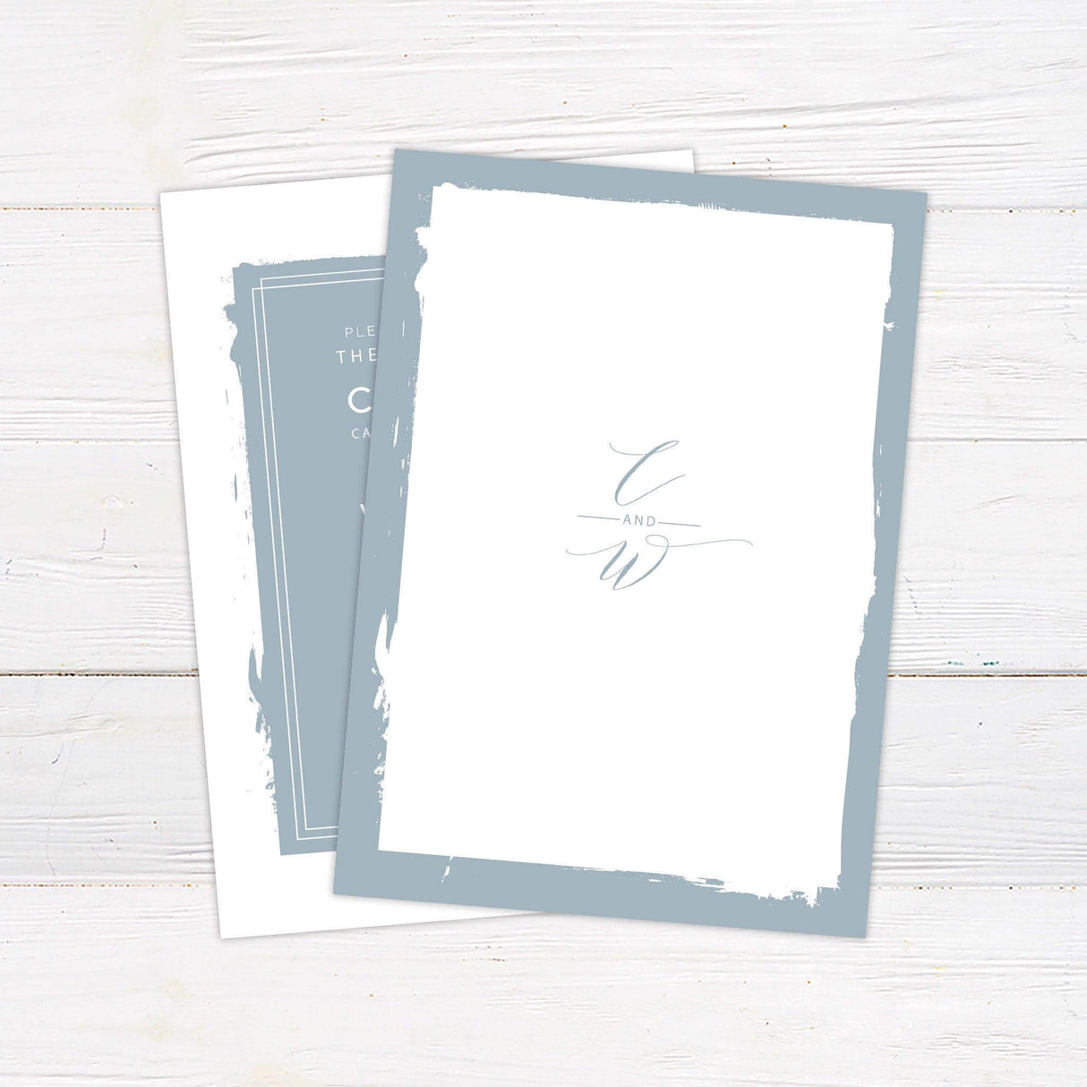 Minimalist dusty blue wedding invitation with modern typography and painted border design - back