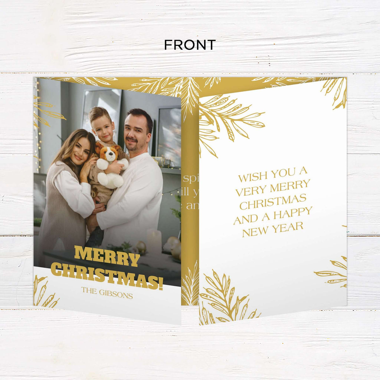 This elegant gatefold Christmas card features a festive gold botanical design on a clean white and gold background. It includes multiple photo slots, customizable text areas, and a holiday greeting for a warm, personal touch. - front.