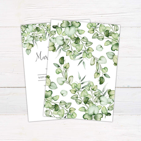 Wedding invitation with green eucalyptus watercolor branches and romantic script on white background with modern event layout - back