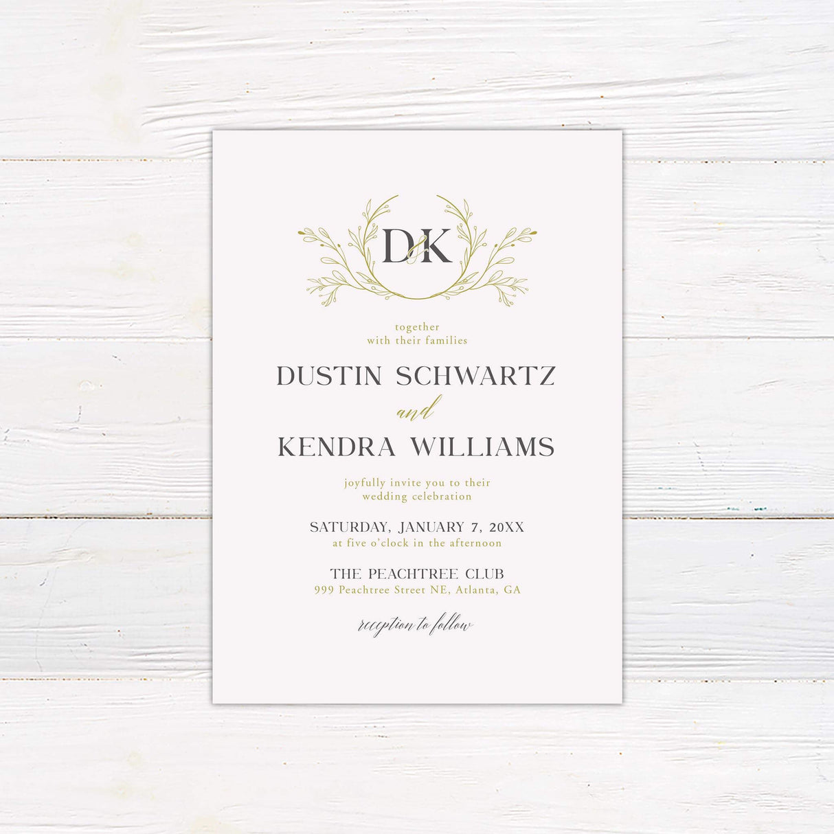 Wedding invitation with gold botanical wreath monogram, serif and script fonts, minimalist white background and formal event layout