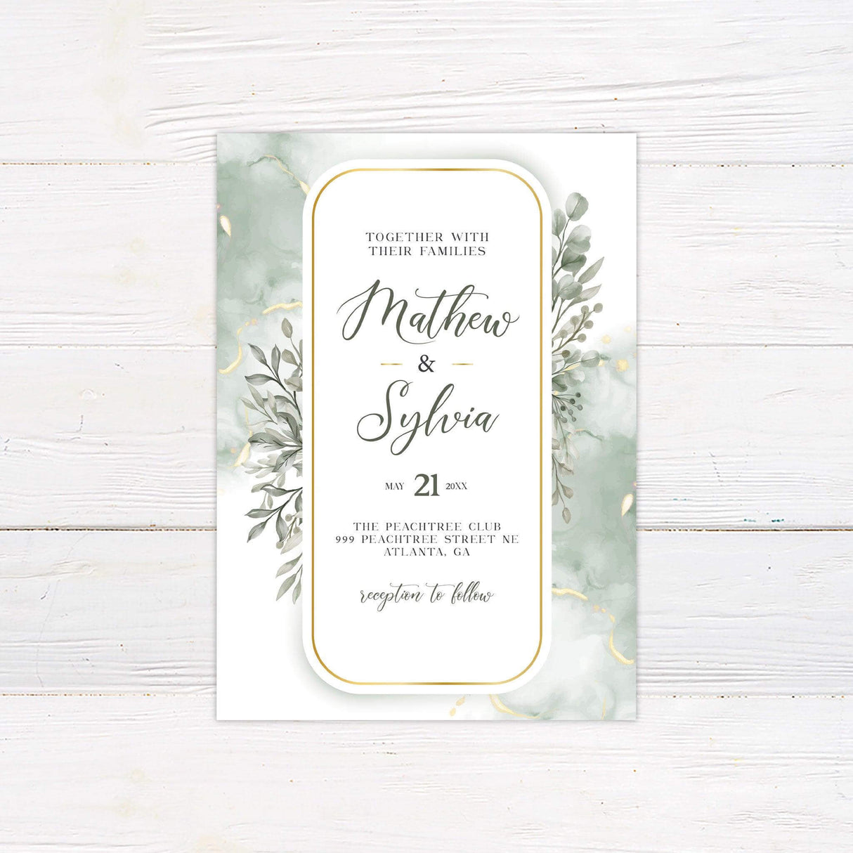 Elegant wedding invitation with sage green watercolor leaves, gold border, and romantic script on white background