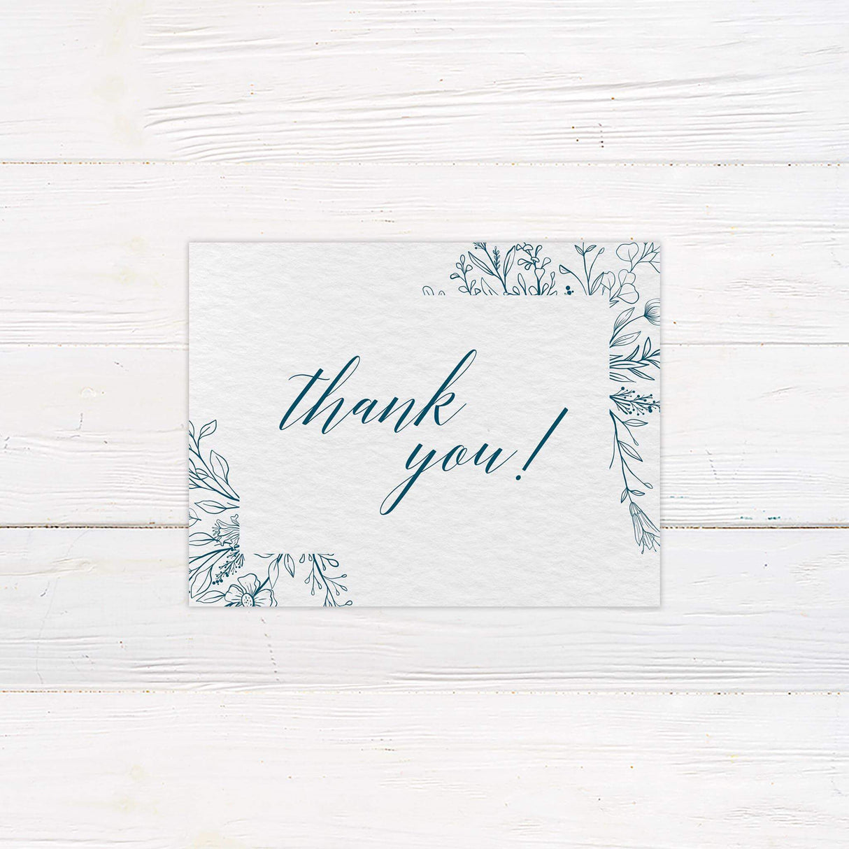 Stylish thank you card adorned with soft floral elements and classic script. A thoughtful and elegant way to express gratitude, designed to coordinate with the full stationery set.