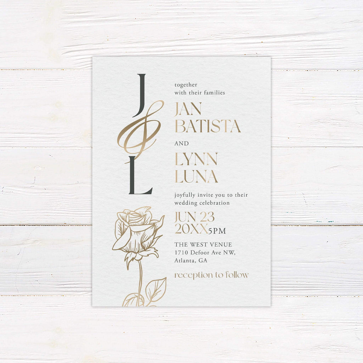Monogram wedding invitation with gold initials, rose illustration, and serif typography on soft textured background
