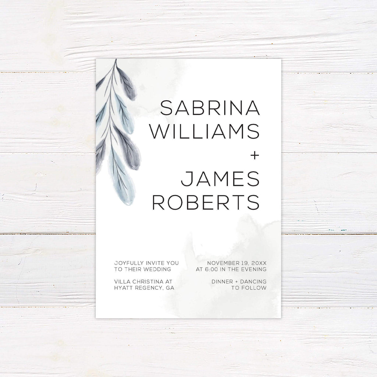 Minimalist wedding invitation with watercolor leaves in sage green and gray tones, modern sans serif font on clean white background
