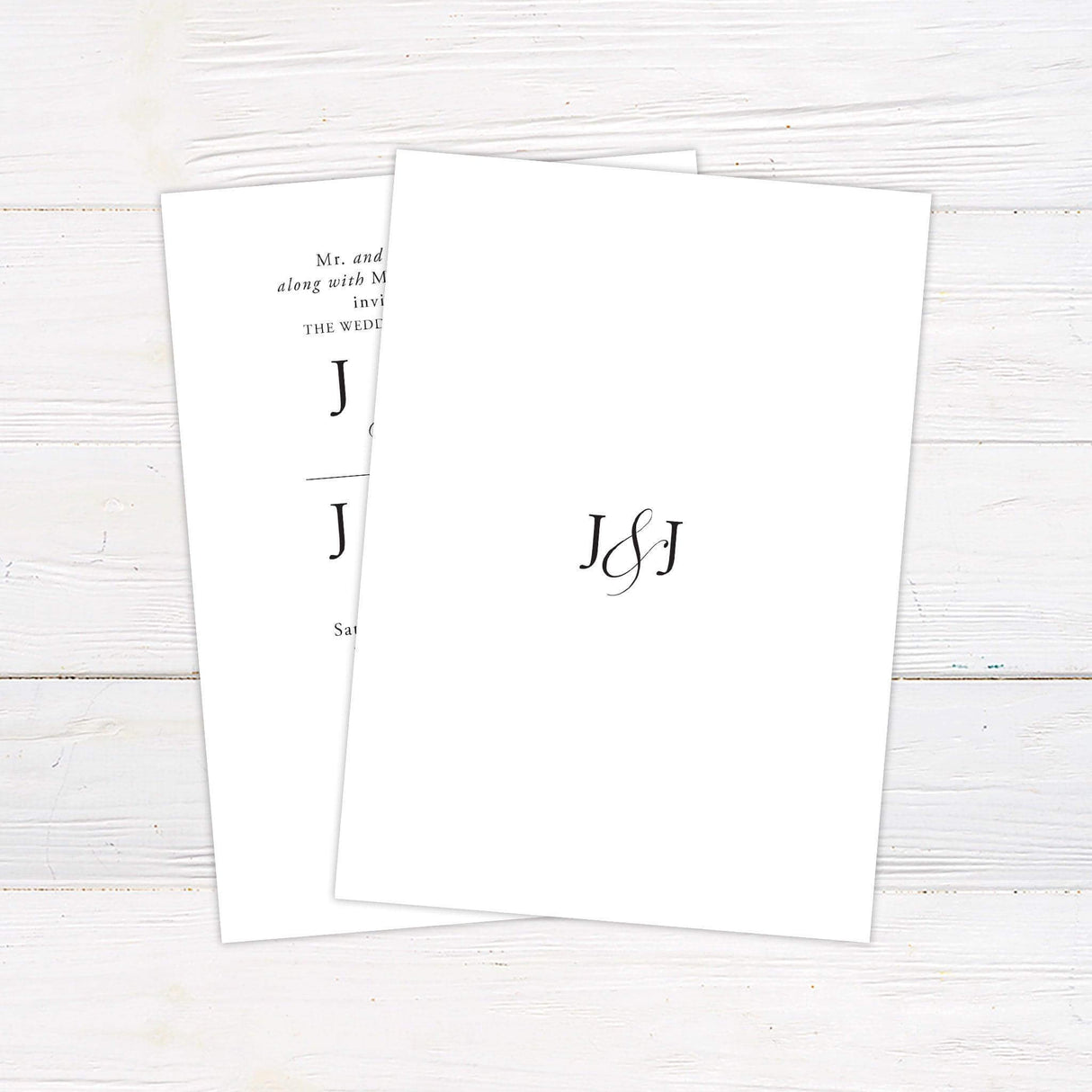 A wedding invitation with a clean, white background features an elegant black serif and script typography design. The text is arranged in a balanced and structured layout, highlighting the couple's names in a bold, classic font. Event details, including the date, time, and venue, are displayed in a refined and timeless style. This minimalist and sophisticated design is perfect for a formal, modern, or traditional wedding celebration. Back