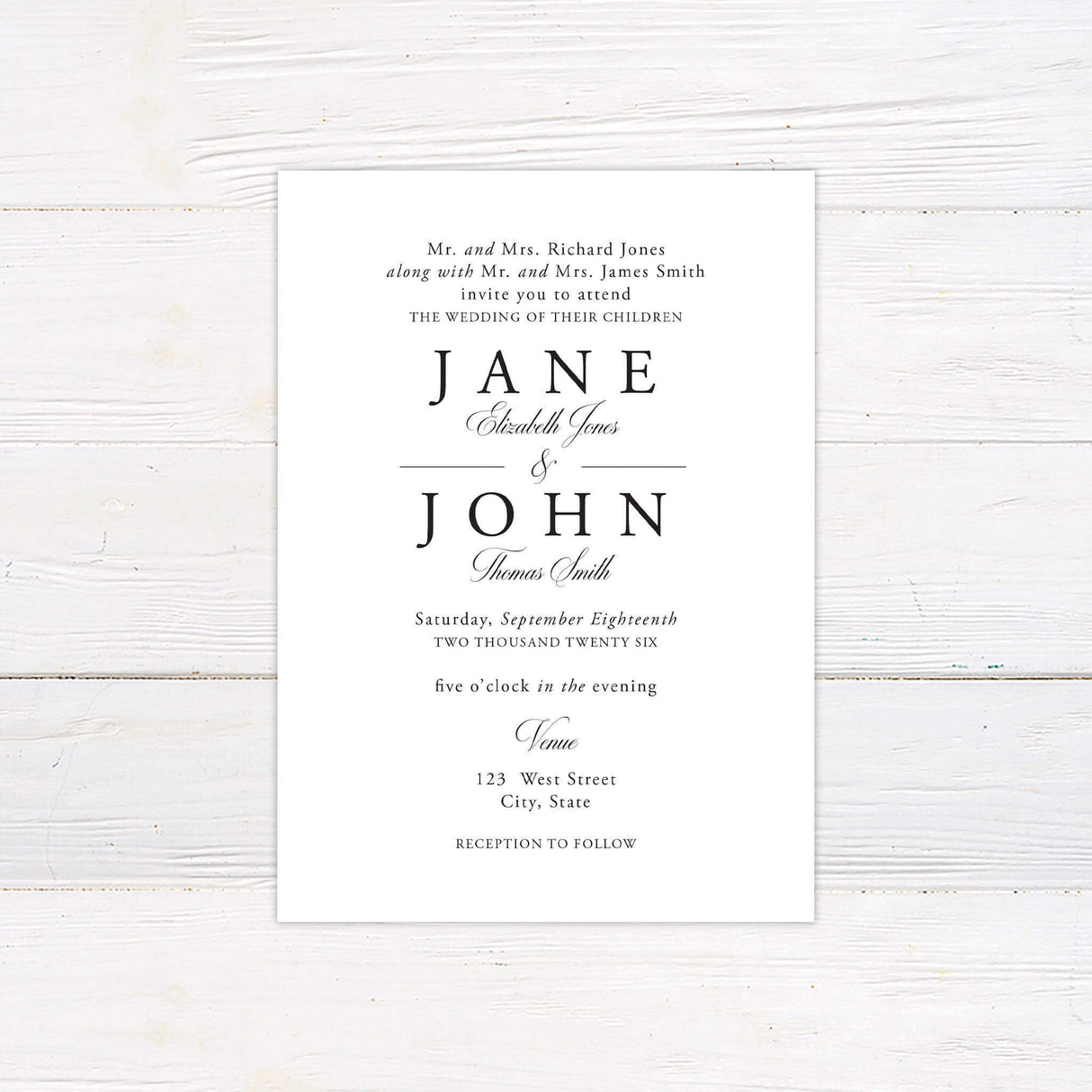 A wedding invitation with a clean, white background features an elegant black serif and script typography design. The text is arranged in a balanced and structured layout, highlighting the couple's names in a bold, classic font. Event details, including the date, time, and venue, are displayed in a refined and timeless style. This minimalist and sophisticated design is perfect for a formal, modern, or traditional wedding celebration.