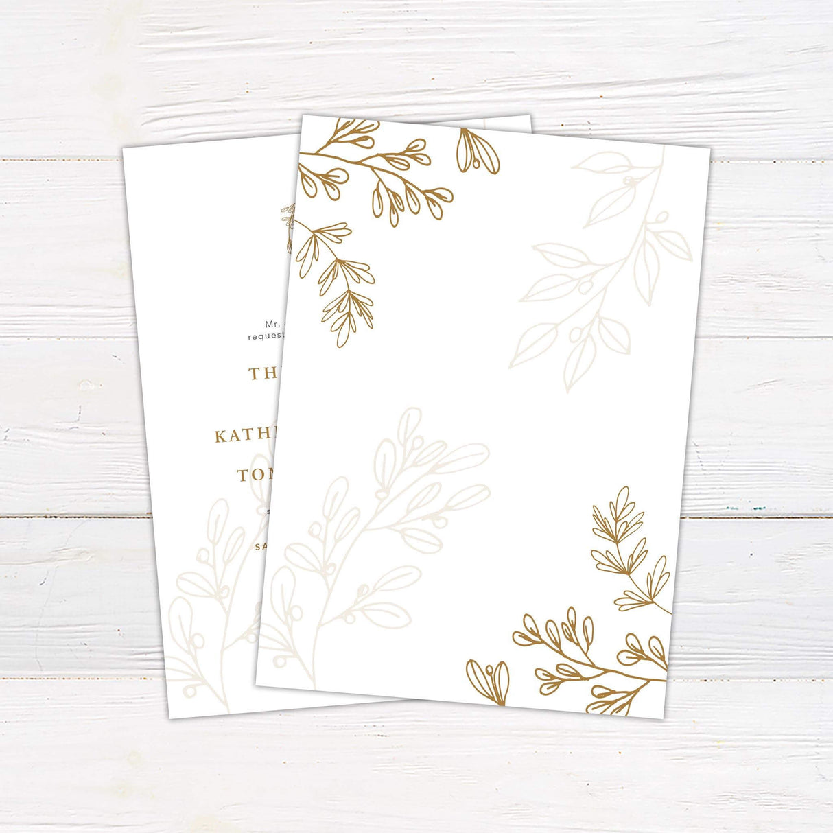 Elegant wedding invitation with gold wreath monogram, formal serif fonts, and soft botanical illustrations on a white background - back