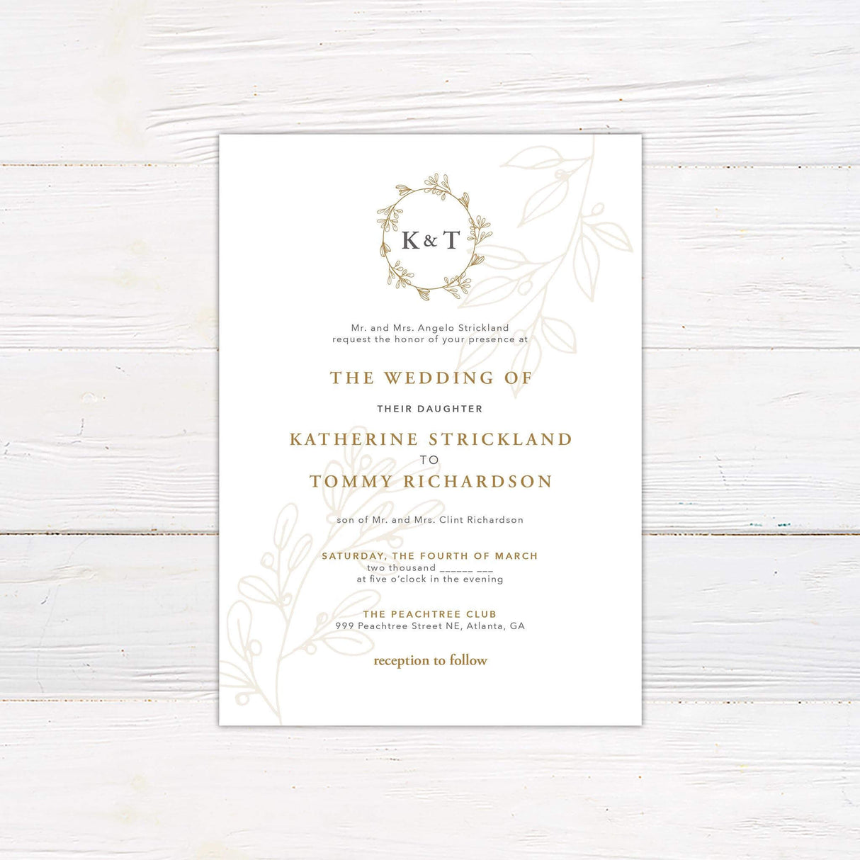 Elegant wedding invitation with gold wreath monogram, formal serif fonts, and soft botanical illustrations on a white background