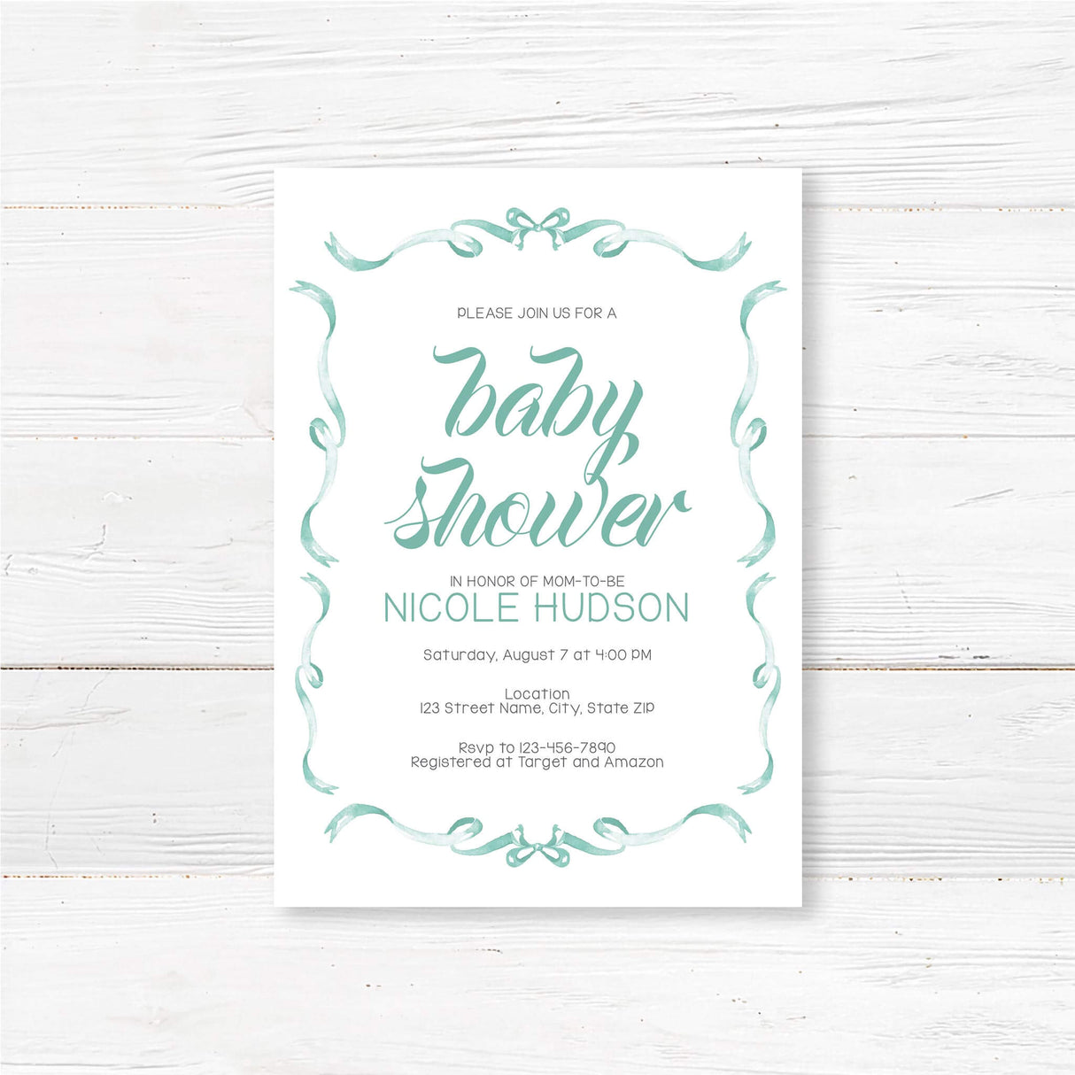 Elegant ribbons baby shower invitation with flowing script and ribbon border on wooden background. Perfect for charming celebrations.