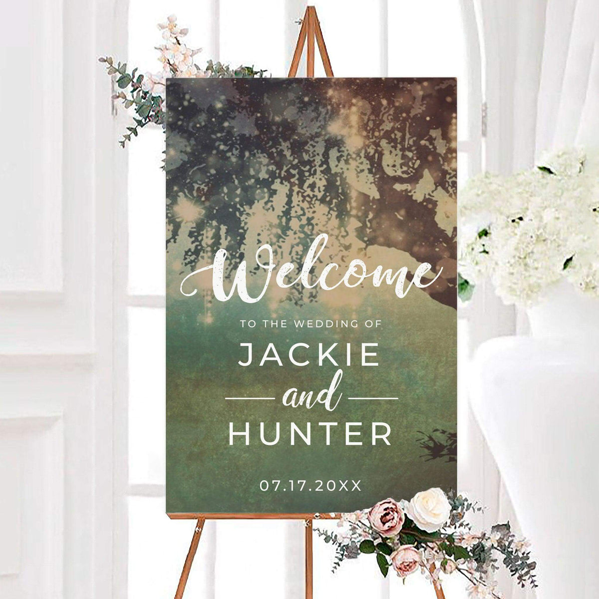 Enchanted forest wedding welcome sign with a dreamy woodland background and glowing light effects. White lettering displays a welcome message, personalized couple names, and wedding date.