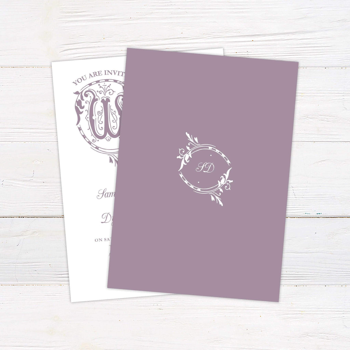 Vintage wedding invitation with ornate lavender scroll design and romantic serif and script fonts on white background, ideal for fairytale-themed weddings. - back